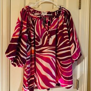 Silky boutique top. Brand new with tags.